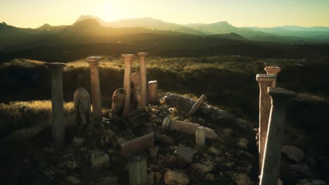 old greek temple ruins at sunset