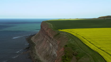 aerial dolly shot of yorkshire headland on sunny spring day