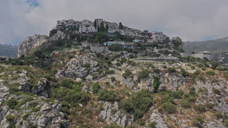 Eze-France-Aerial-v20-close-up-low-level-flyover-hilltop-medieval-village,-exotic-garden-and-fort-ruins,-birds-eye-view-from-the-top-of-the-fortress---July-2021