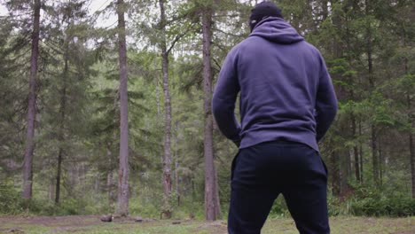 man exercising in the forest