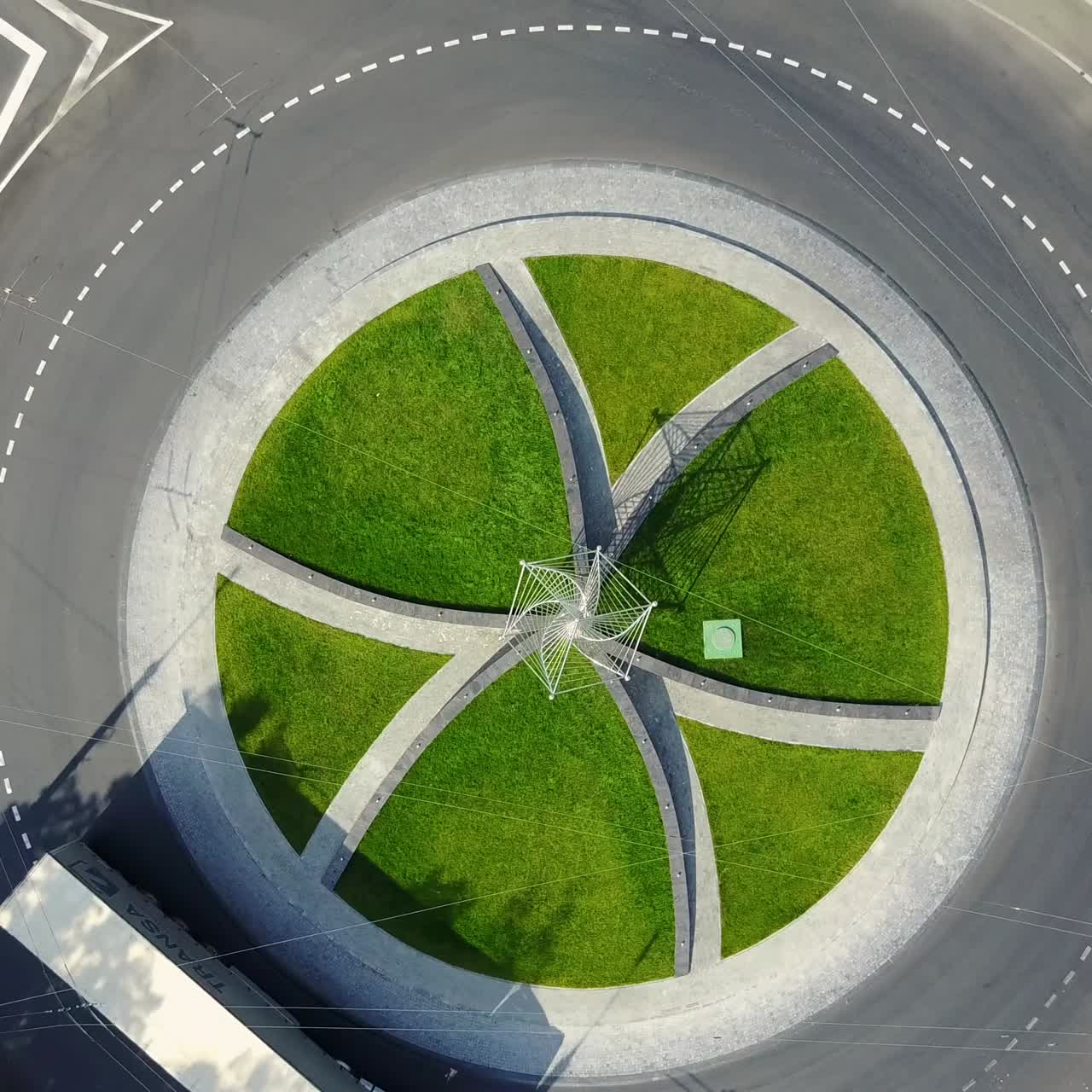 City Traffic At Roundabout. Flying above huge roundabout full of cars and trucks at rush hour