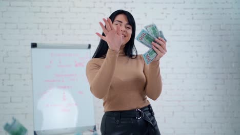 satisfied woman with euro currency banknotes. excited girl scattering money on white wall background. symbol of success.