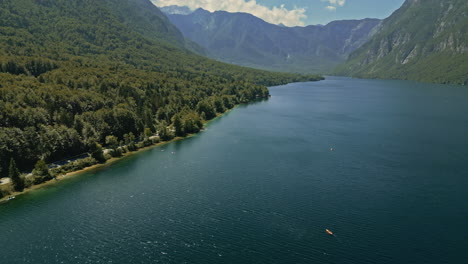 Panoramic-aerial-dolly-of-Lake-Bohinj-Slovenia-sunny-glistening-bright-day