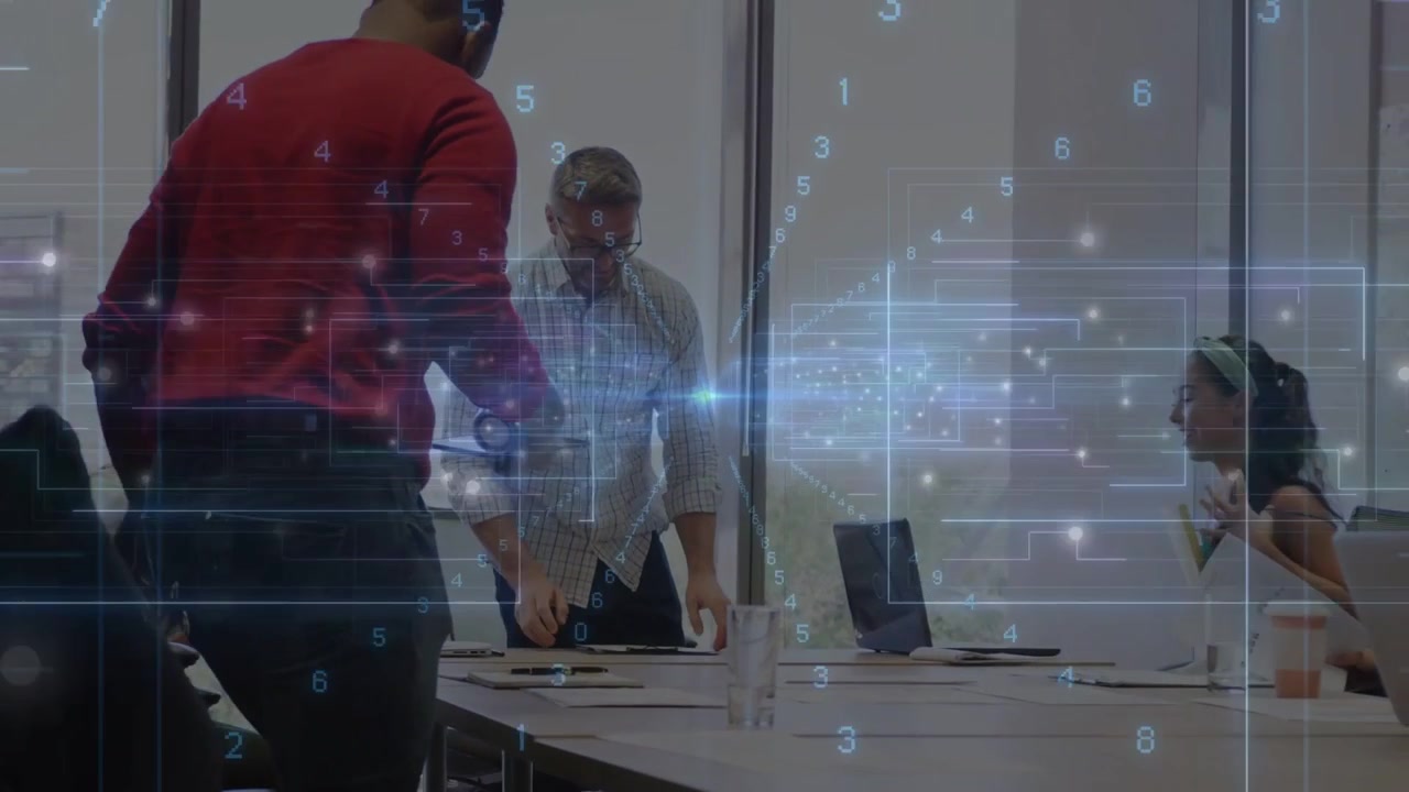Vertical video: Red man arriving, team arranging laptops under transparent tech overlay for meeting