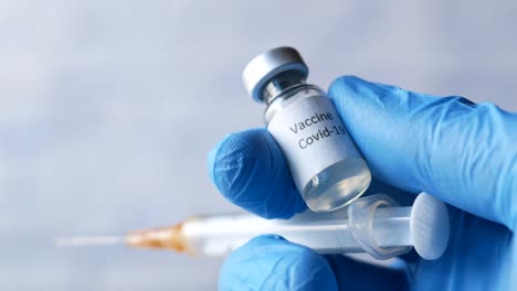 covid-19 vaccine and syringe