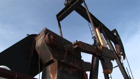 Closeup-Of-An-Oil-Pump-Turning-In-The-New-Mexico-Desert