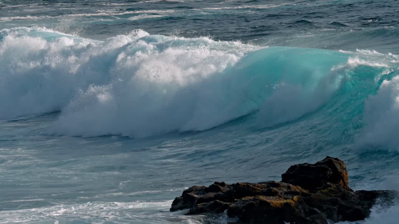 Powerful Atlantic waves crash against the rugged volcanic coastline near Timanfaya National Park in Lanzarote, part of Spain’s Canary Islands.