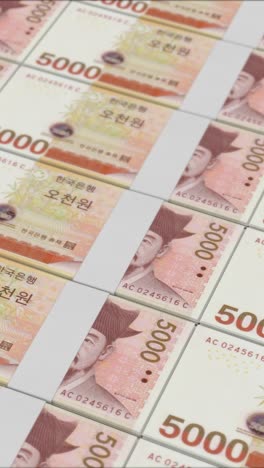 vertical video of 5000 south korean won banknotes printing by a money press