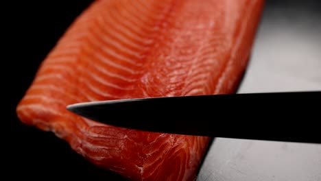 cutting fresh salmon