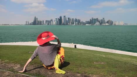 woman looking doha skyline