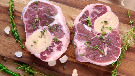 raw ossobuco on wooden cutting board