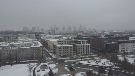 drone video of warsaw city skyline on a snowy and foggy day3