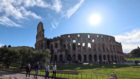 tourists exploring the historic colosseum under the sun