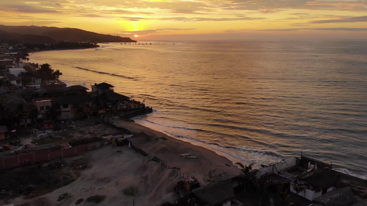Flying sideways showing the beautiful bay at Mancora, perfect surf destination