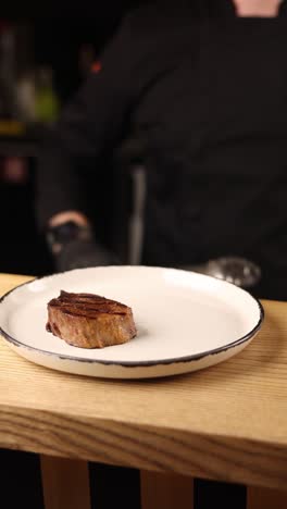 chef preparing a grilled steak