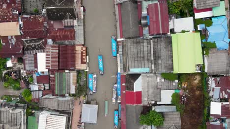 aerial ascending top-down view of amphawa floating market, thailand