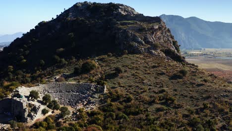 Aerial-view-of-Kaunos-ancient-city-and-the-castle-at-the-top-of-the-mountain