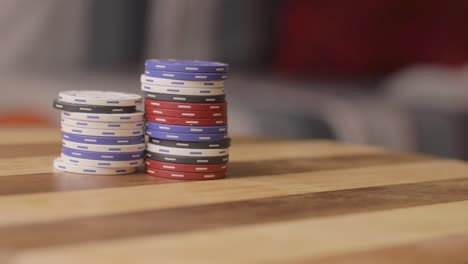 static of a man removing stack of poker chips