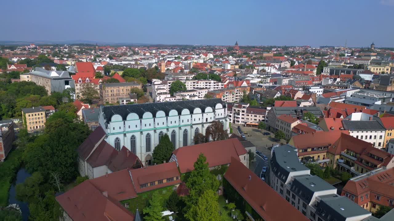 Dome to halle in the city in germany is shining on a sunny summer day. Lovely aerial view flight panorama