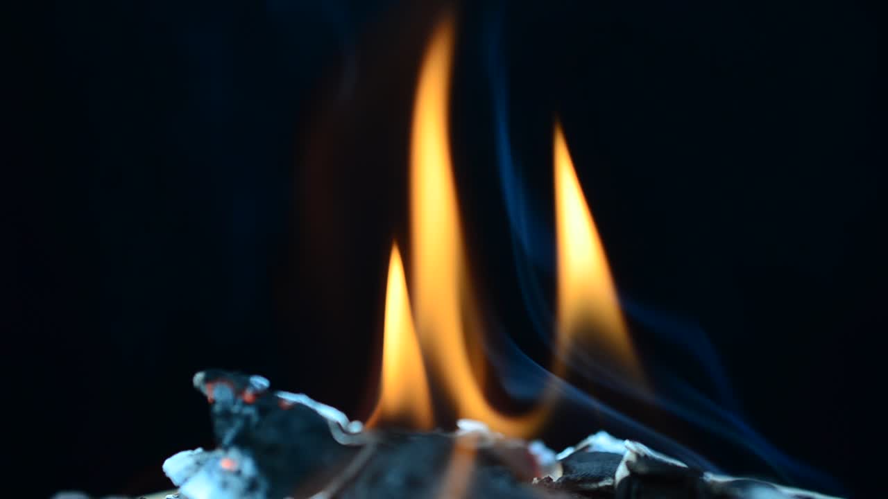 The burning fabric on a black background. The burning fabric