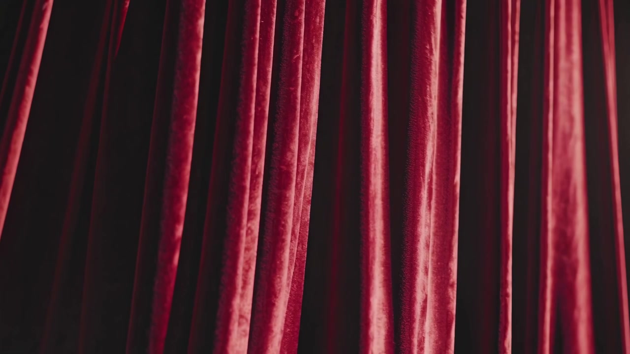 Red Velvet Theater Curtains Opening on Stage