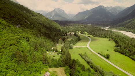 aerial view of a valley and the main street surrounded by hills in slovenia.