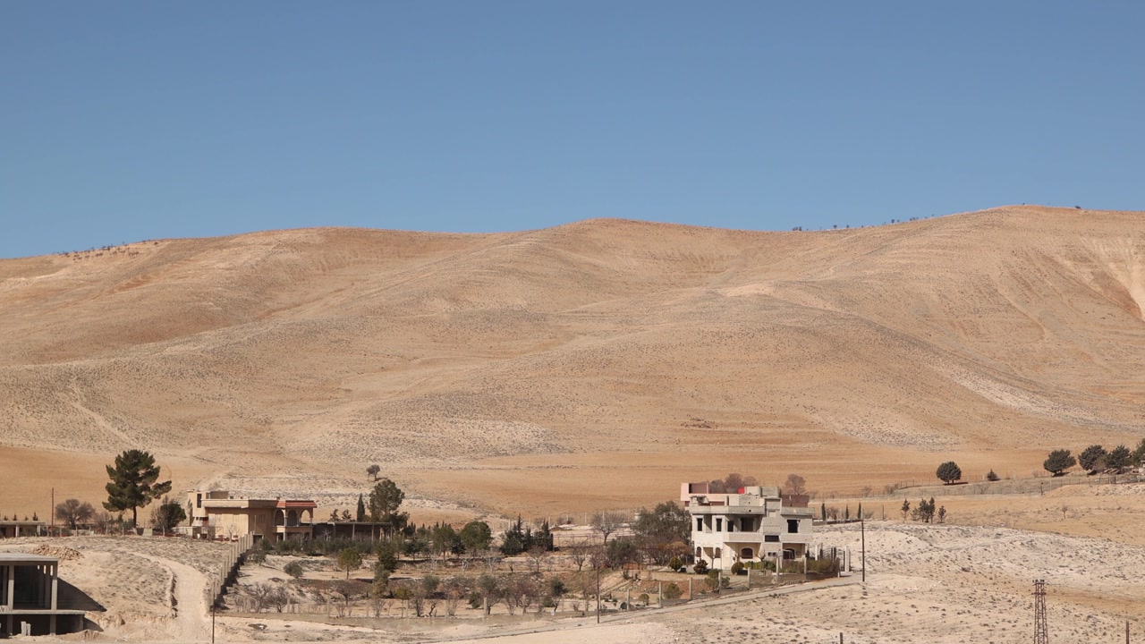 Scenic landscape view of the desert terrain and mountains surrounding Ma'aloula, Syria. Remote arid environment and geological formations near the historic Christian village