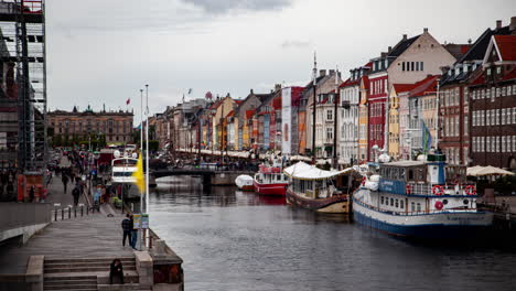 nyhavn harbor timelapse: boats, colorful buildings &amp;amp; tourists, copenhagen