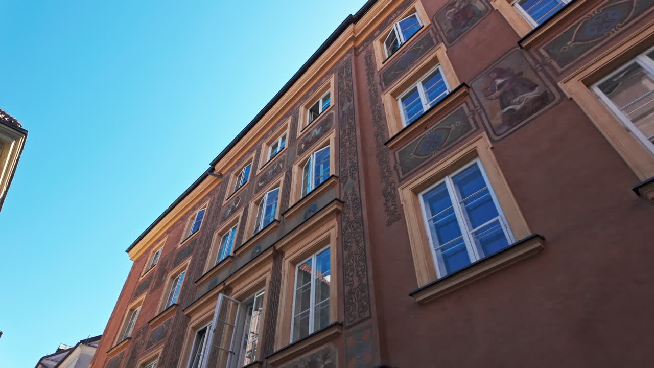 Beautiful view of historical architecture in Warsaw's old town, with artistic facade