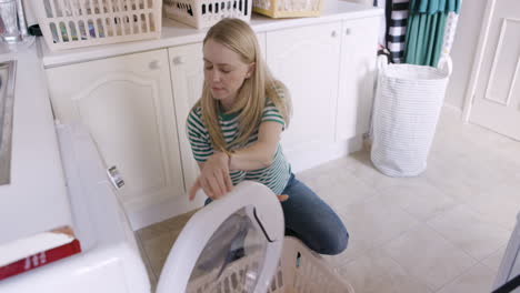 woman doing laundry in a laundry room