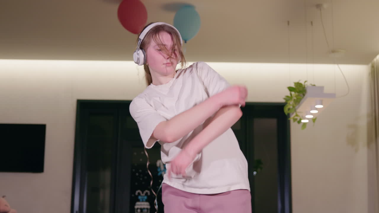 Teenage Girl Dancing at Home Party