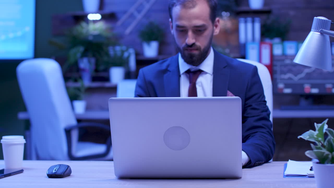 Office Environment with Laptop and Businessman