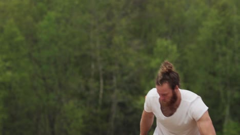 Strong-Caucasian-Man-With-Beard-Splitting-Logwood-With-Nature-Forest-Background