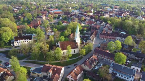 aerial view of kuldiga old town with red roof tiles and evangelical lutheran church of saint catherine in kuldiga, latvia