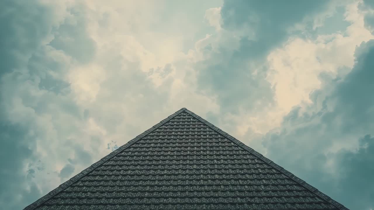 Drifting cloud clusters moving across sky above shingled roof apex outdoors, showing changes