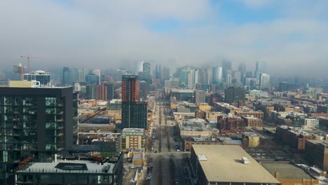 establishing-aerial-drone-shot-of-Chicago-downtown-during-a-cloudy-day-with-the-sun-piercing-through-the-clouds