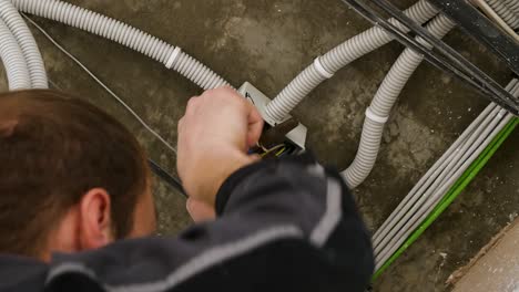 electrician installing electrical cables