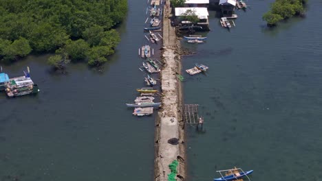 drone view of balibayon pier with fishing boats in surigao city