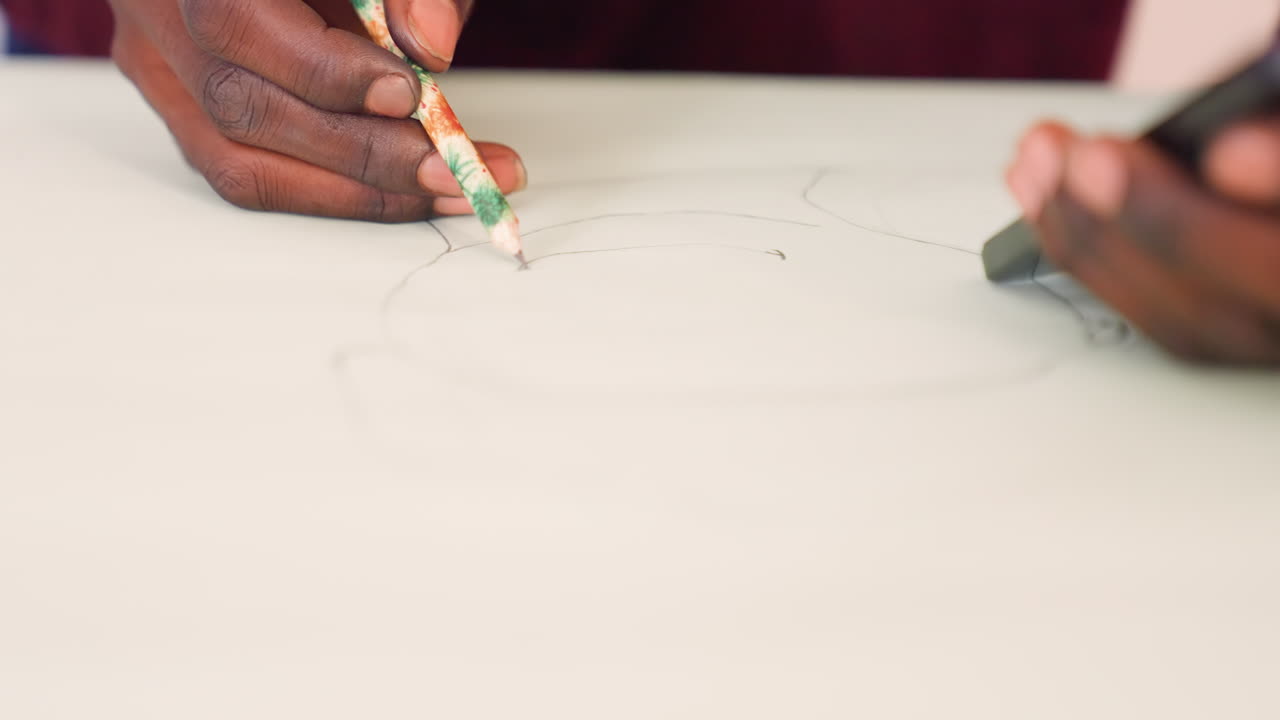 Drawing with careful hand movements. Creating circular design on paper with delicate pencil strokes. Artist modeling precise circular layout on paper using measured wrist and gentle pressure