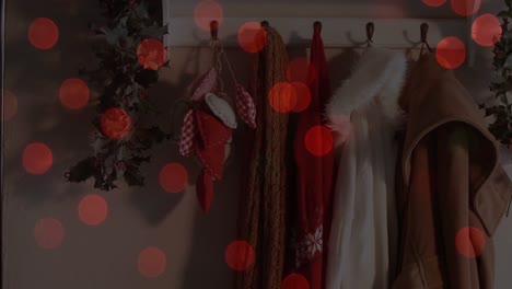 Animation-of-red-lights-flickering-over-house-interior-with-christmas-decoration