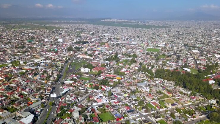 Top drone view of downtown the charming town of chalco Mexico, and view of the downtown and roads towards Mexico City