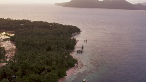 Aerial-View-Of-Beach-Resort-Near-Paddy-Fields-With-Seascape-At-Sunrise-In-Southern-Leyte,-Philippines