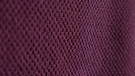 carpet buying. close up of hand feeling the smooth and soft texture of a carpet sample.
