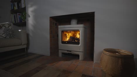 lit stove burning in shadowed room