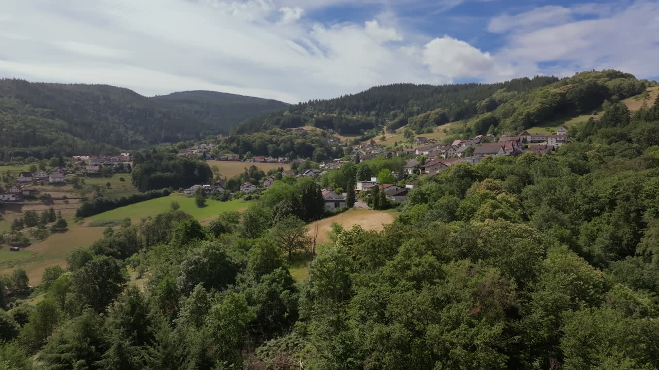 Aerial footage of German town and green landscape