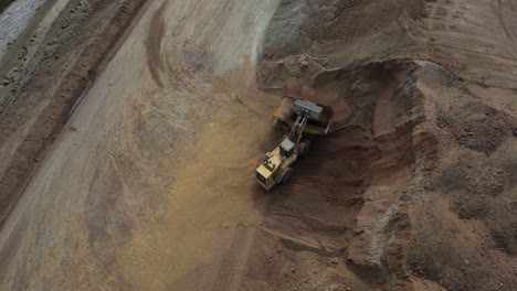 Orbit-Shot-Of-Excavator-Filling-Up-Truck-In-Nickel-Mine-Site-In-Western-Australia