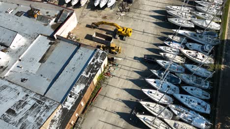 a slow look at a yard full of old and retired sailboats