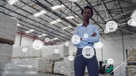 standing with arms crossed, warehouse worker with network of connections in storage area