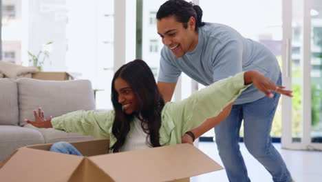 moving, box and a homeowner couple playing