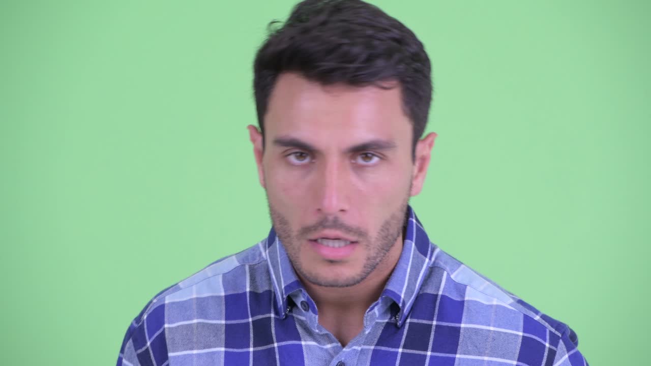 Young handsome Hispanic man